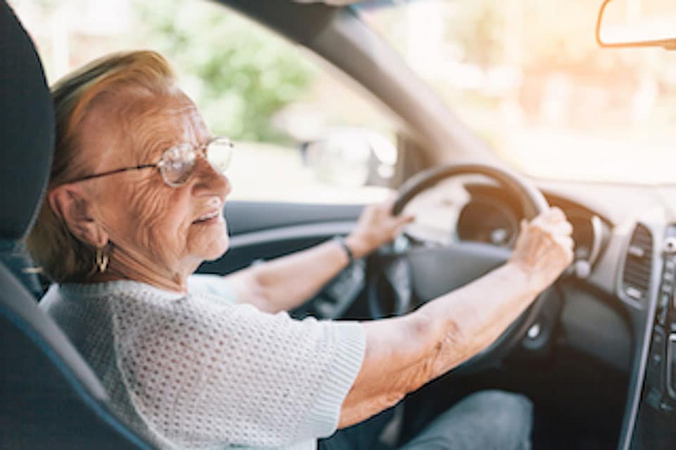 elderly woman driving
